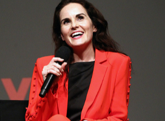 Michelle Dockery attends Netflix Celebrates event in August in dashing red suit